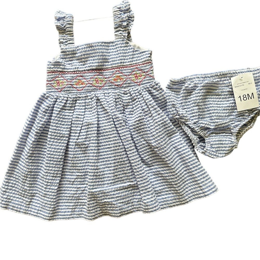 Baby sleeveless dress with embroidery details